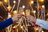 two people clinking champagne glasses, holiday background