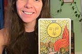 Rozalia Kieliszkiewicz holding the Sun Tarot Card Energy