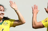 Megan Schutt and Elyse Perry celebrating after taking a wicket