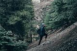 Man on a steep hill looking up