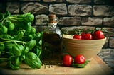 Tomato, oil and basil, symbols of Italian cuisine