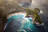 An aerial view of a mountainous shoreline