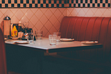 Red vinyl booth at a neighborhood diner