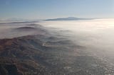 Morning fog spread along mountain range