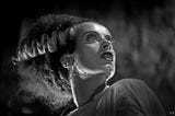 An actress in a monster movie performs in makeup