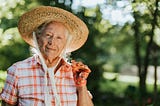 Happy senior woman with strawhat