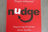 A battered red copy of Nudge by Richard H. Thaler and Bass R. Sunstein