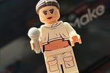Singer Daya in LEGO minifig form in front of the EufyMake E1 UV printer.