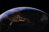 This is a photo of the Earth from space, showing the thin blue line of our atmousphere.