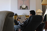 After Long Day of Sitting at Home, Man Looking Forward to Sitting at Home in Different Chair