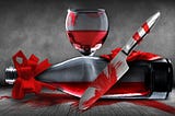 wine glass, bottle and knife all covered in blood
