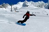 Author leans into a turn on his snowboard on Mt. Hood in Oregon