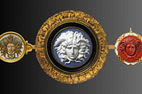 Images of 3 round Medusa cameos made by 3 different designers. One mosaic, one Wedgwood blue, one carnelian. Each encircled with gold.