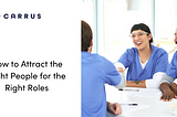 A group of healthcare workers sitting at a table smiling as they shake hands