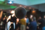 silver corded microphone in shallow focus