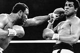 Joe Fraizer punching Muhammad Ali