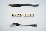 knife & fork with KETO DIET written small plates