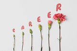 flowers with “career” spelled on top