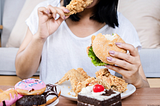Women binge eating processed foods because she is addicted.