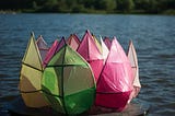 Plastic flower sculpture in a lake.