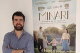 Type designer Dominic Stanley in front of a poster for the Minari movie which uses his Traho font