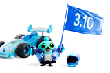 A fun image of the Flutter mascot, Dash, standing by a racecar. She is holding a blue flag with “3.10” printed on it.