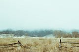 Broken Boundary Fence in Mountains