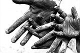 Dirty worker hands symbolizing labor abuse