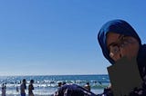 A Girl in Hijiab at the Beach