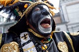 Protestors Call For An End to Zulu’s Blackface Tradition