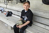 Bat Boy Serves an Inspiration to Players, Community