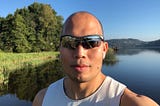 Picture of the author with a river in the background.