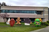 A photo of Android dessert sculptures celebrating Android OS releases in front of Google Building 44 in Mountain View, CA.