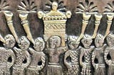 Bas relief showing a priest carrying the Ark of the Covenant accompanied by trumpeters