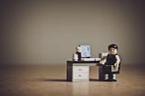 A LEGO character sitting in front of a PC from the medium blog of Federico Trotta