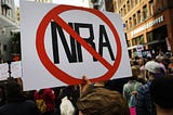 A protest sign with the NRA crossed out.