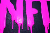 Image of ‘NFT’ In Neon Pink With Paint Drips on dark background — ©Bridget Bradley