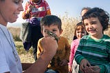 Students watch a bird ringing activity during “A day at the wetland”, organised by environmental group WWF. The same individual, an adult Fringilla coelebs, had been caught again in the same area last year. Lesvos, Greece, 2015, November 15