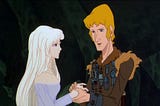 Image: Prince Lír holds Lady Amalthea’s hand in the 1982 Rankin and Bass movie The Last Unicorn.