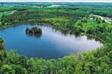 Curleys Lake in Ontario surrounded by forest and land to build home.