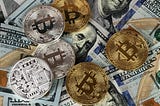 Physical Bitcoin Coins on US Dollar Bills