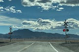 The view toward the south of a railroad crossing where NM 47 intersects with US 60 south of Belen, New Mexico