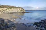 Corwall beach with people walking