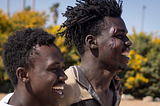 Smiling migrants after crossing in the Spain-Morocco border