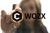 Women holding a WOZX token.