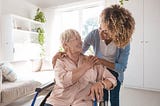 elderly woman enjoys companionship with home health aide