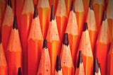 A field of pencils sticking straight up.