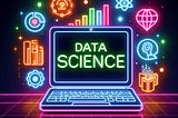 Picture of a neon colored laptop with screen displaying “Data science” and neon colored data science related icons around and behind the laptop.