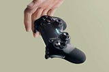 Person Holding Sony DualShock 4 Wireless Controller