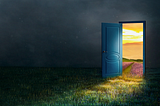 A door opening from the dark onto a sunlit meadow